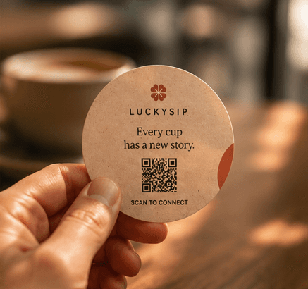 A hand holding a LuckySip card.
